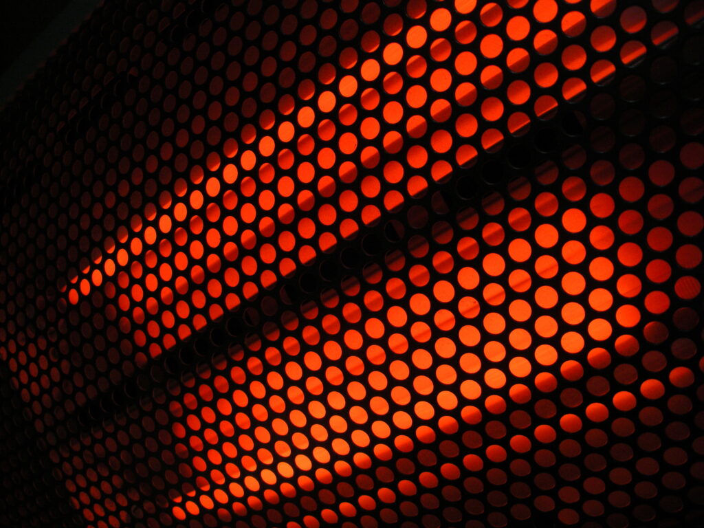 A glowing red light therapy panel.