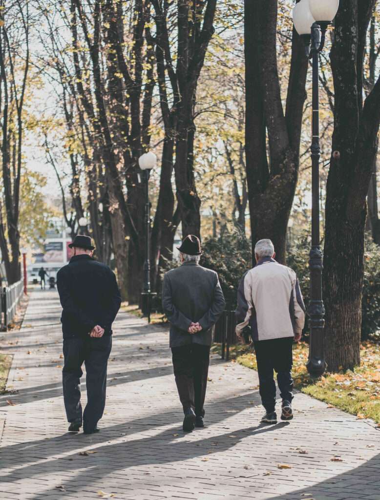 Three seniors going for a walk for exercise.