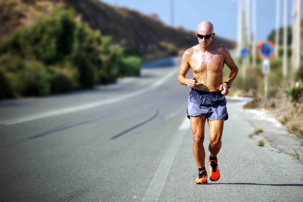 A man out for a run on a hot day.