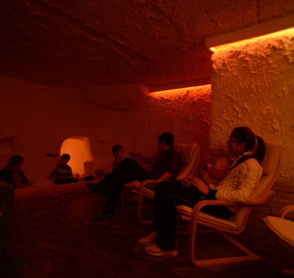 A family trying salt cave therapy.