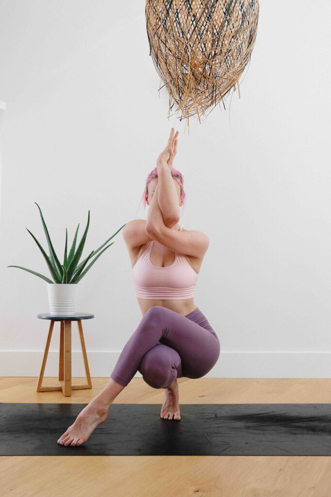 A yogi on a mat demonstrating the benefits of yoga for women.