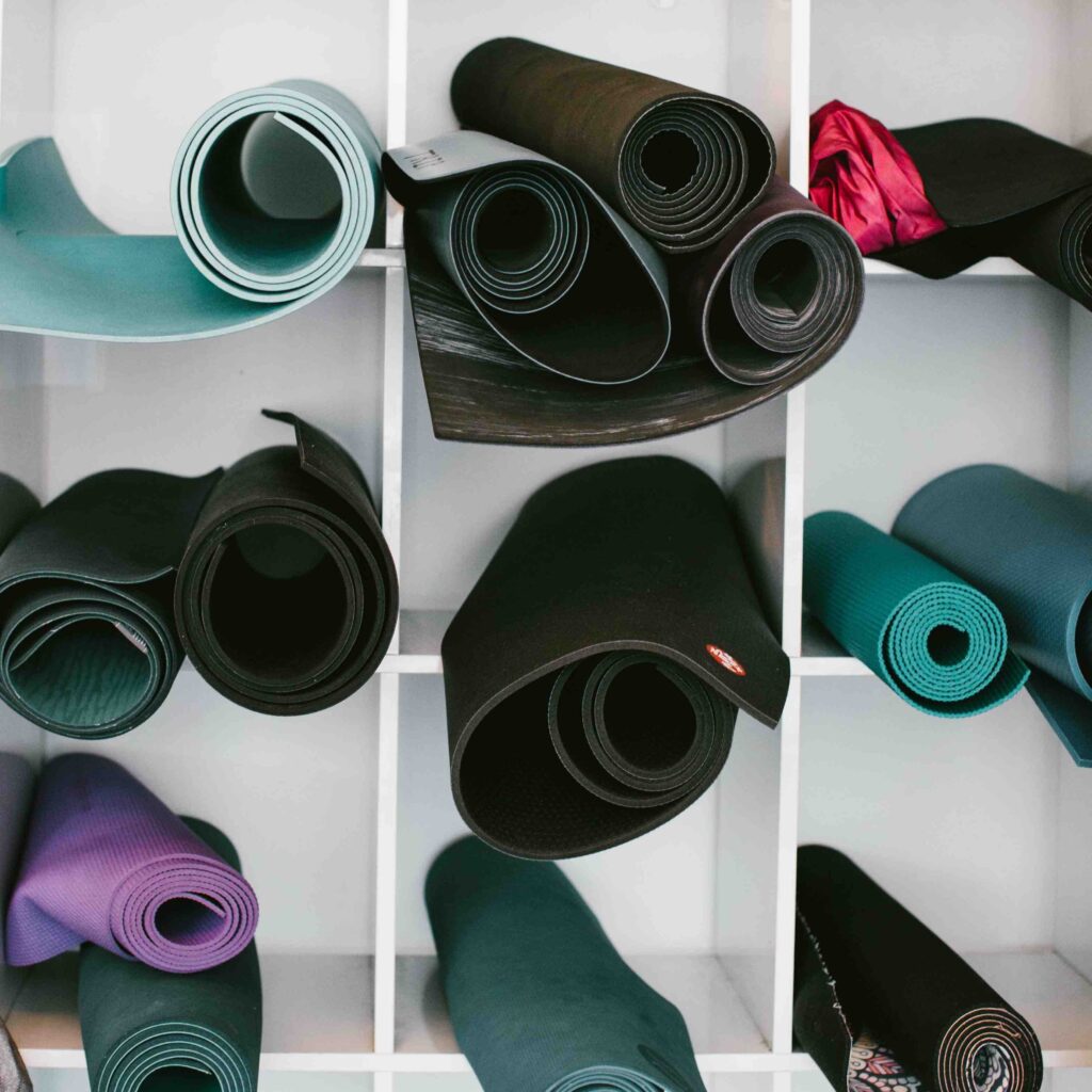 Yoga mats in bins before the start of class.