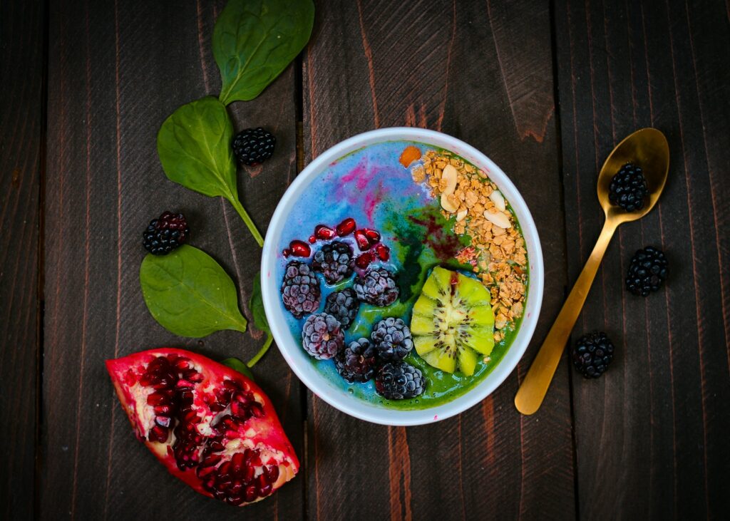 A tasty bowl of fruits, nuts, and other healthy foods.