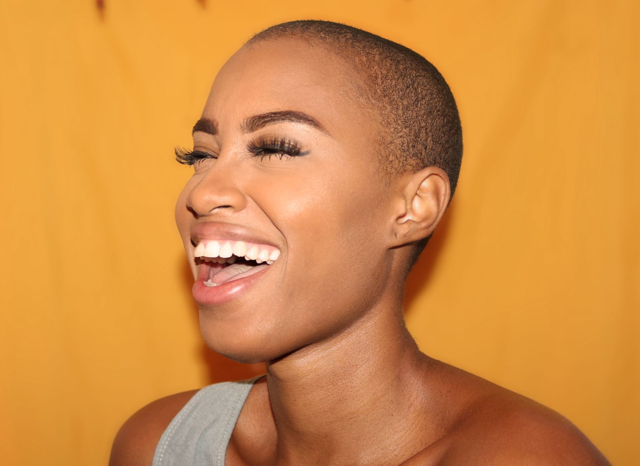 A laughing woman with great skin.