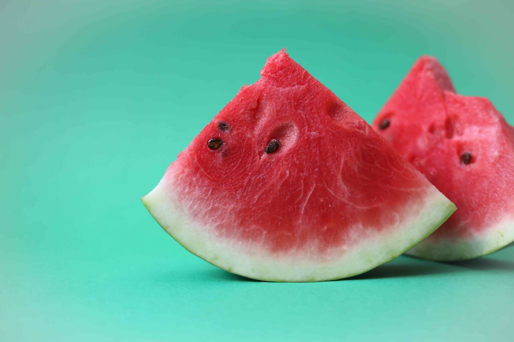 This pair of watermelon slices represents a great answer for how to stay hydrated without drinking water.