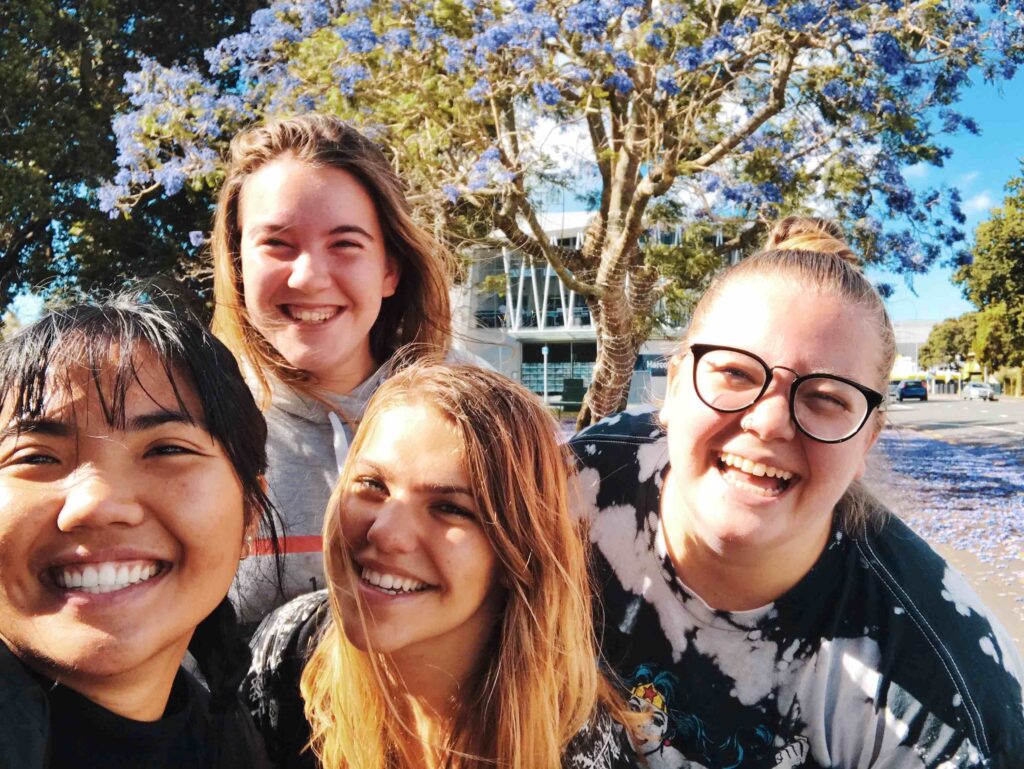 A group of women smiling.