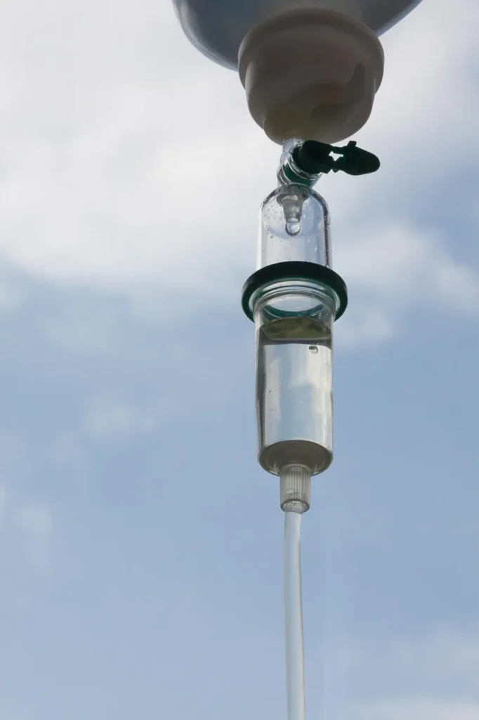 hospital 834154 1280 IV infusion therapy equipment against the backdrop of a blue sky.